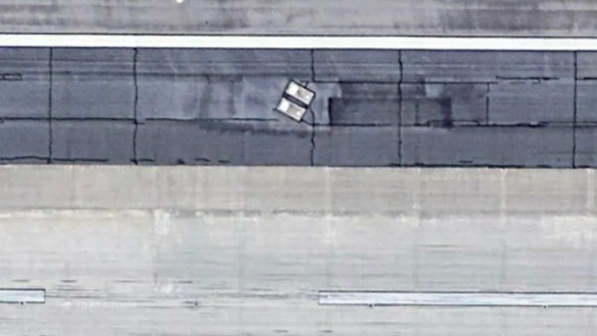 Google Maps shows two people buried in graves under airport runway