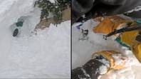 令人难以置信的时刻埋葬活着的滑雪者被滑雪者救了，他在山上发现了脚
