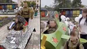 俄罗斯的幼儿园孩子们打扮成装有字母Z的军用车辆