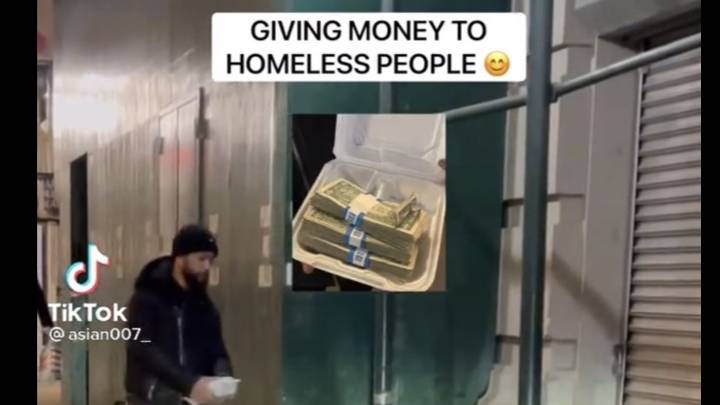 人类的病毒视频将钱交给无家可归的人分开意见