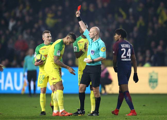 Carlos was shown a second yellow card, which was later rescinded (Image: Alamy)