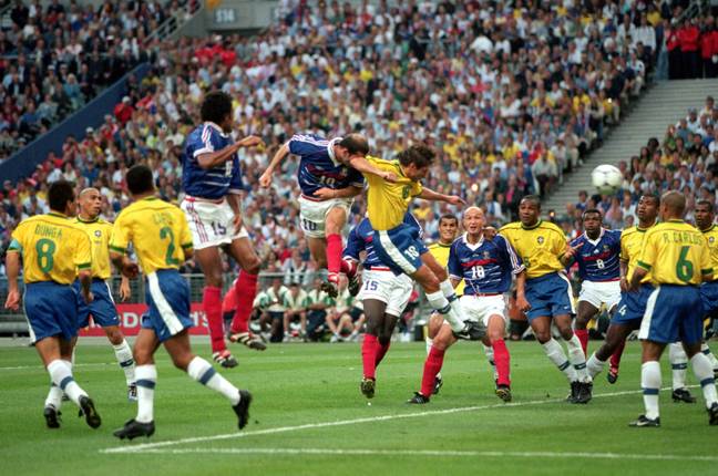 Zidane heads home the first goal against Brazil. Image: PA Images