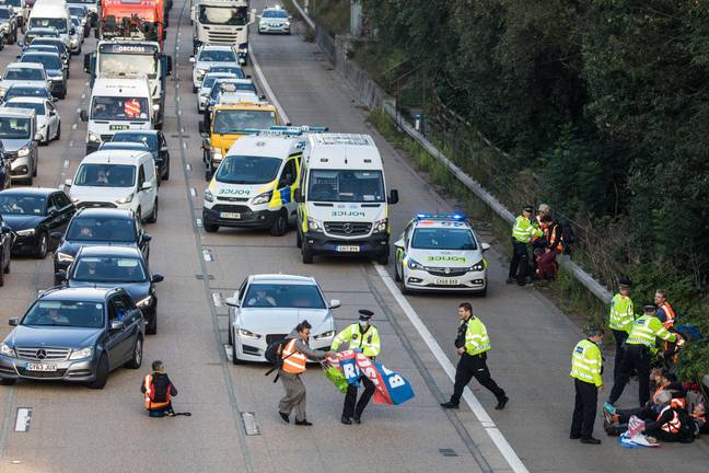 Insulate Britain activists block the M25 in October. Credit: Alamy