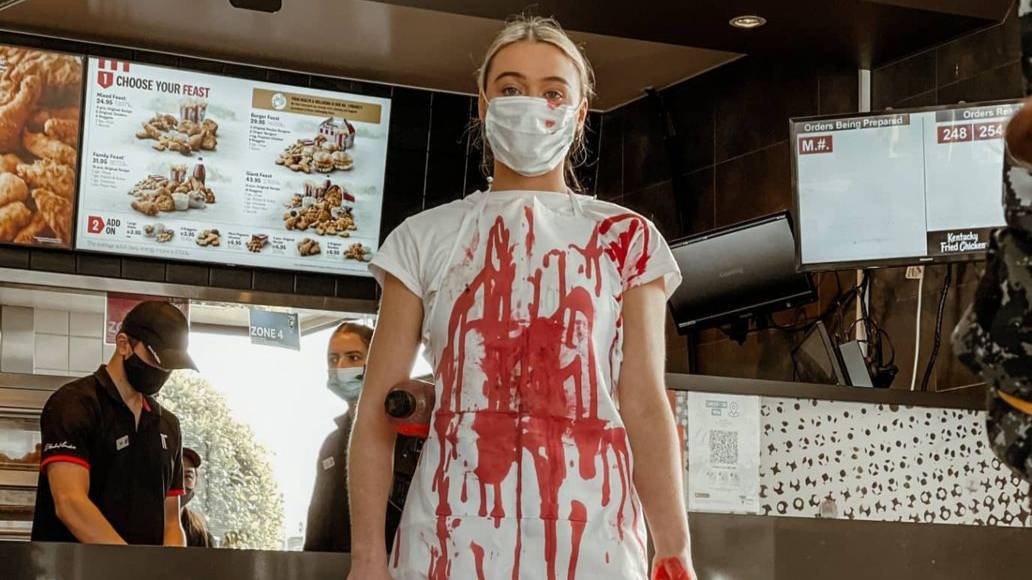 Vegan activist pours fake blood over KFC floor in protest