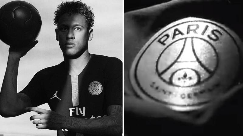 Neymar Jr. posing in PSG's black CL kit with the Air Jordan logo