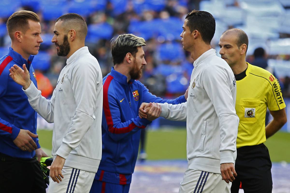 Lionel messi and cristiano ronaldo in a playful moment