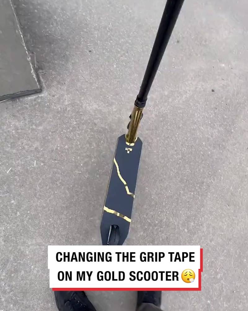 Adding grip tape to a gold scooter