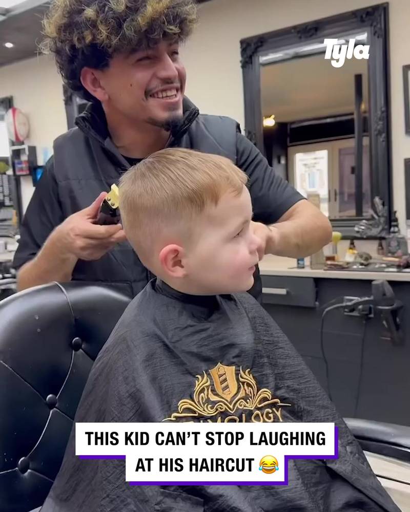 Kid laughs uncontrollably at barbers