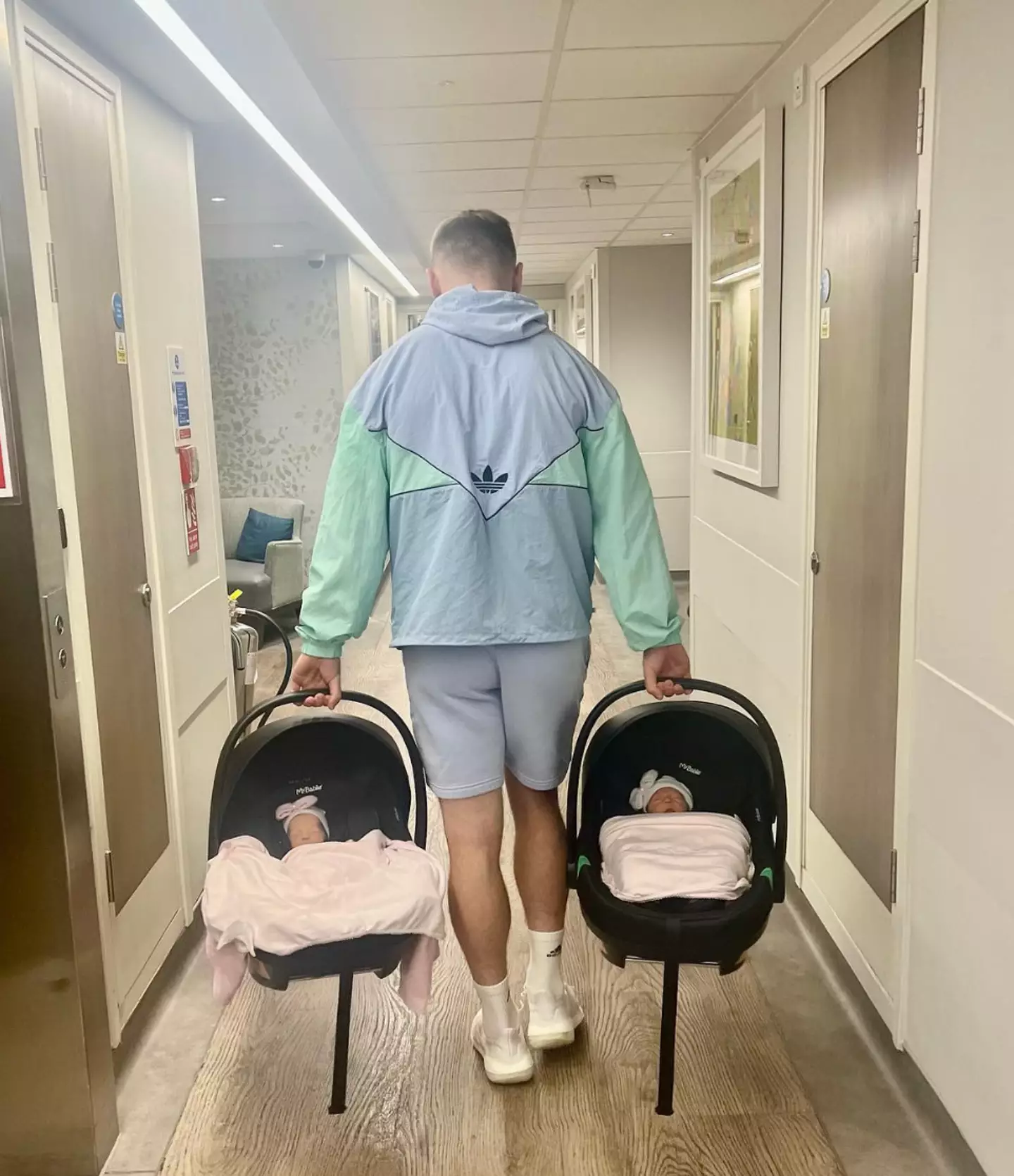 Jarrod leaving the hospital with the twins.