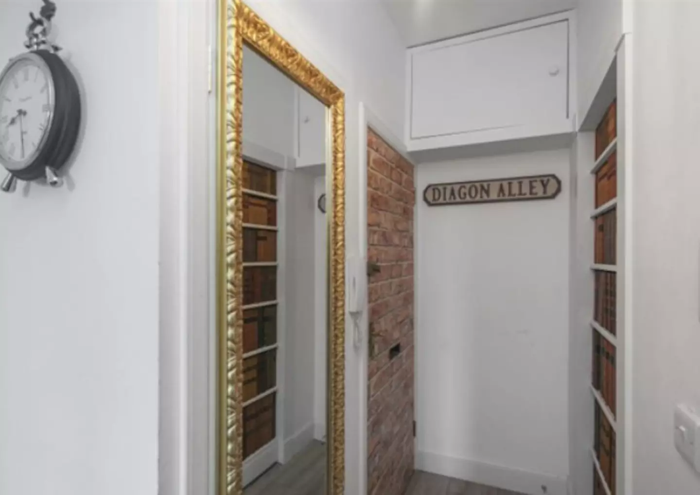 It has secret storage space disguised by a long Hogwarts-esque mirror (