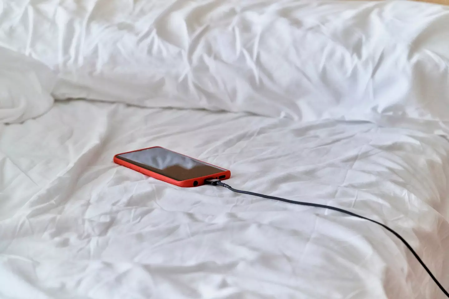 A firefighter has warned of the three major reasons why you should never leave your iPhone on charge overnight as you sleep. (aire images / Getty Stock Images)