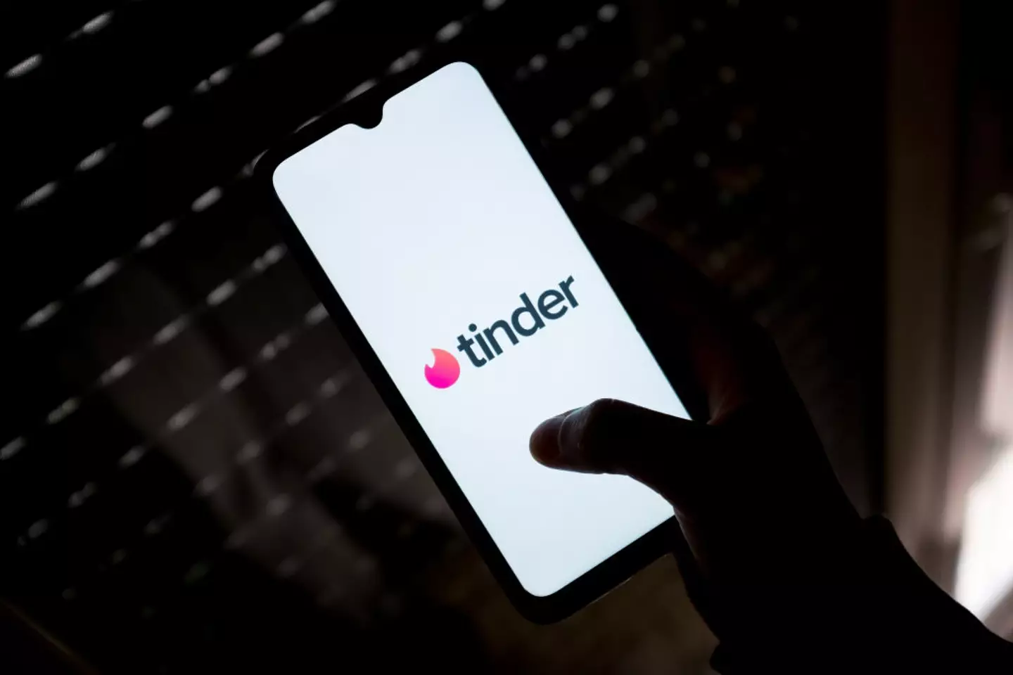 Tinder has implemented various ways to warn users of potential scams or fraud. (Getty Stock Photo)