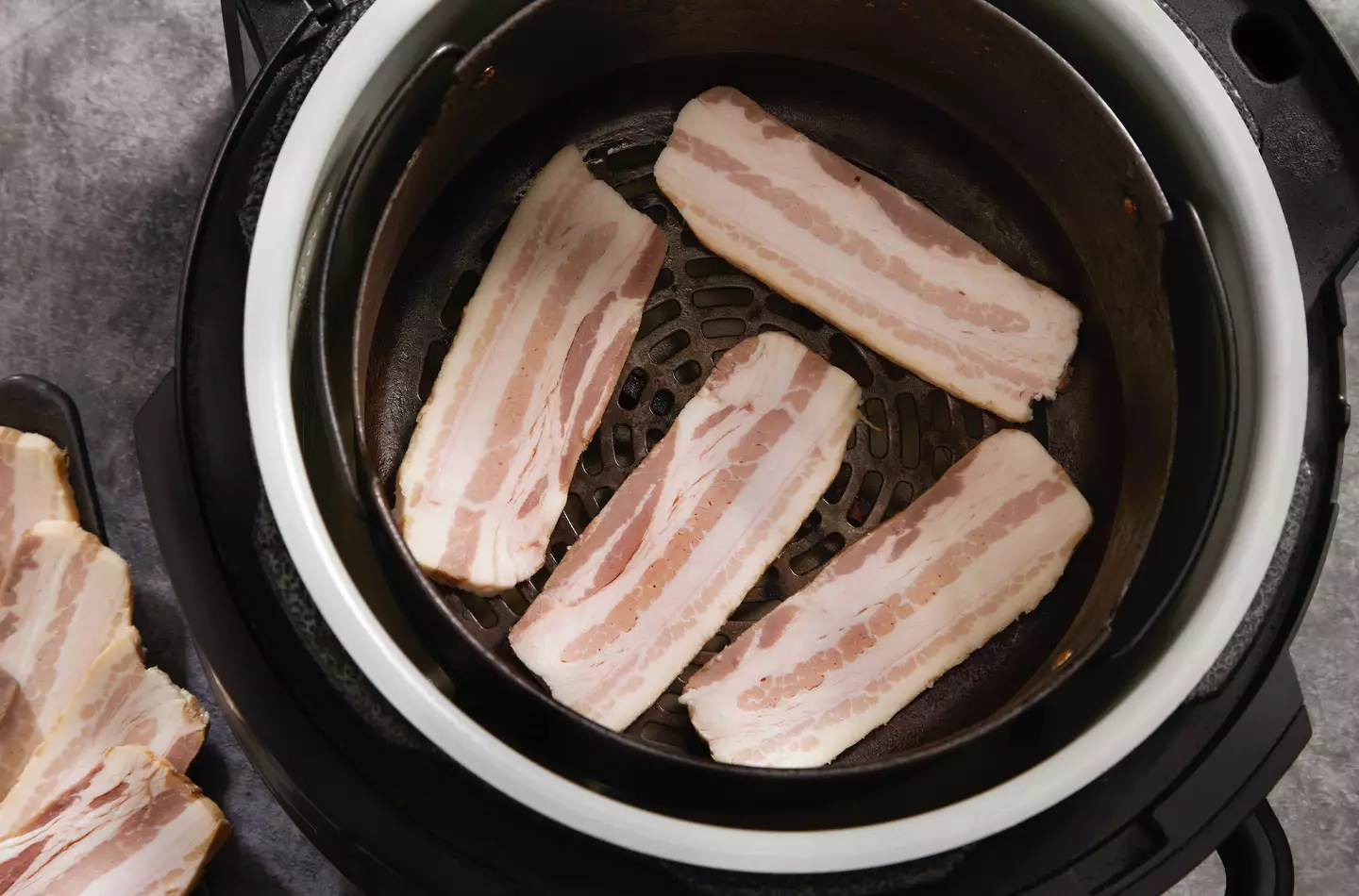 Bacon in the airfryer should be avoided at all costs. (LauriPatterson/Getty)