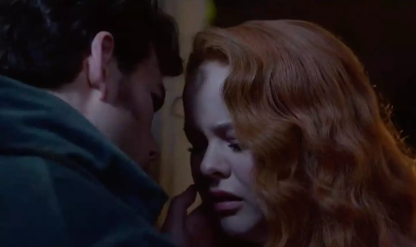 Colin appears to go in for a third kiss. (Netflix)