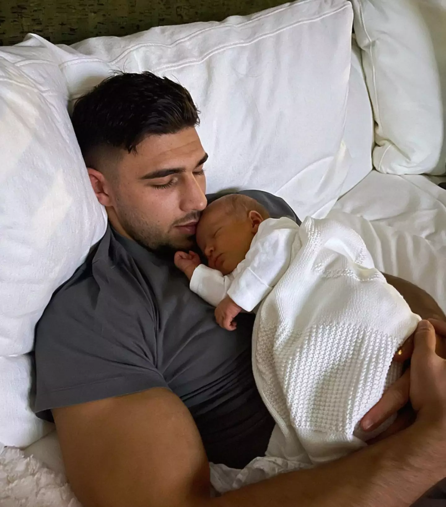 Tommy Fury cuddling with newborn daughter, Bambi.