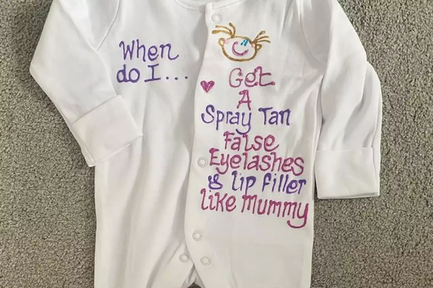 The babygrow featuring the controversial slogan.
