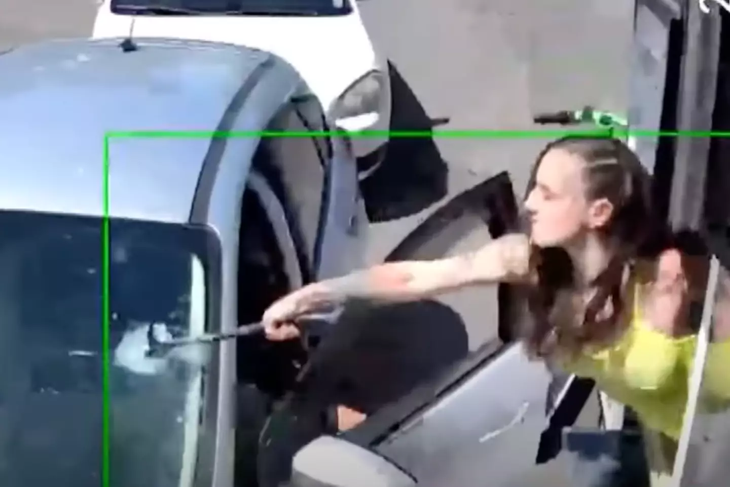 A barista in Seattle ended up smashing a customer's windshield with a hammer after they threw a coffee order at her. (KREM 2 News/YouTube)