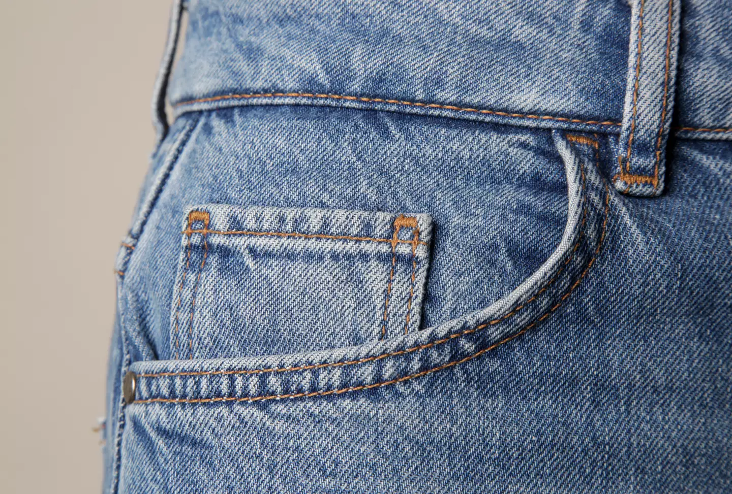 The small pocket actually dates back to 1890, and were stitched into Levi's 'waist overall' jeans with a specific purpose in mind. (Getty Stock Image)