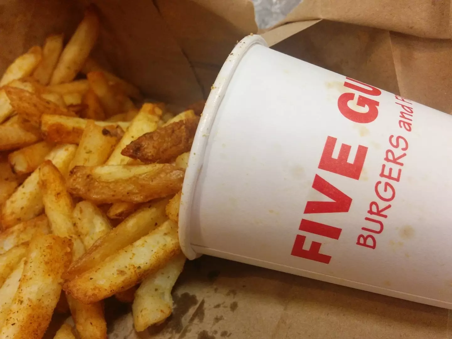 The Five Guys founder has explained why staff give customers so many fries.