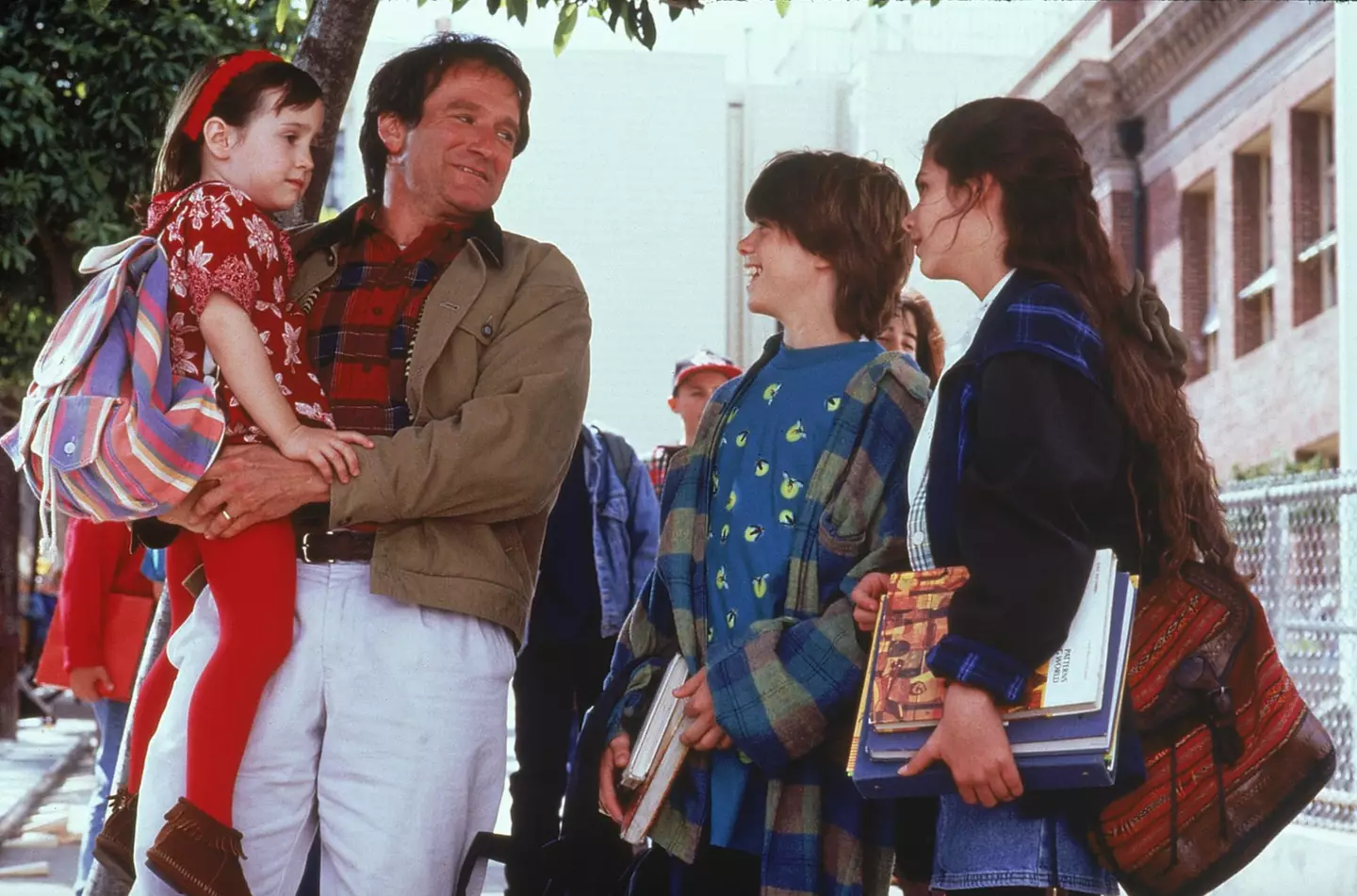 Robin Williams with the trio of kids. (20th Century Studios)