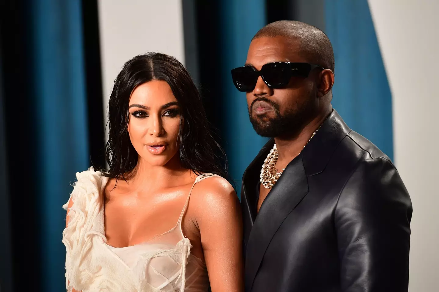 Kanye West is alleged to have shown an intimate photo of his ex Kim Kardashian to former employees.