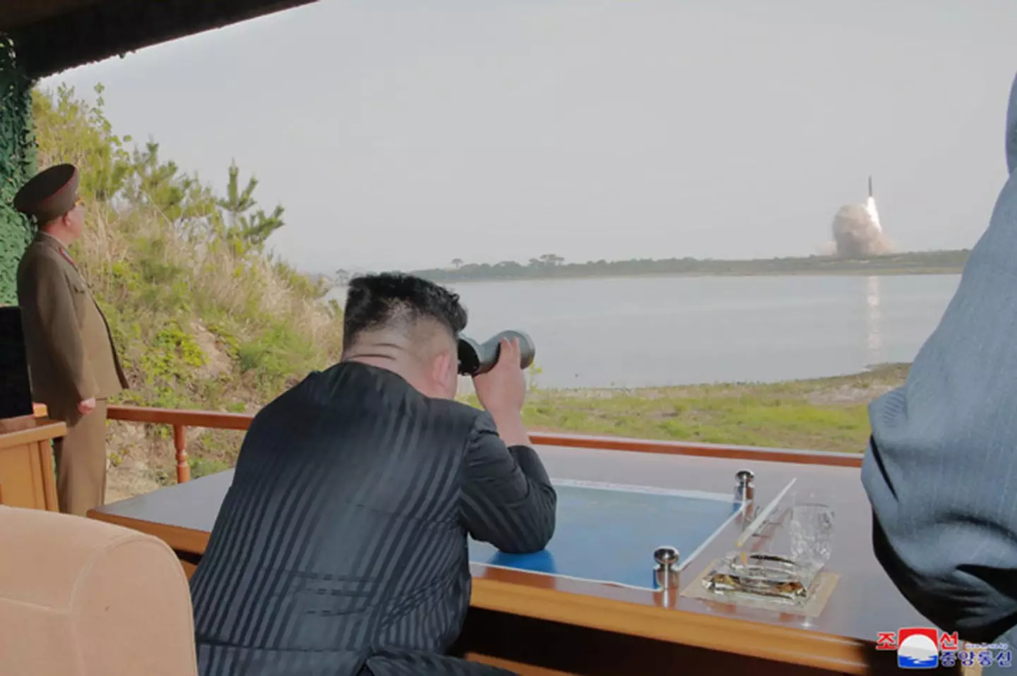 North Korean leader Kim Jong Un supervising a military strike drill.
