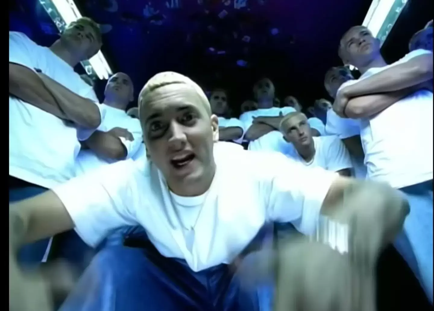 Rocking black tees instead of white, Eminem is surrounded with his imitators in a shout out to the old video. (Eminem/YouTube)