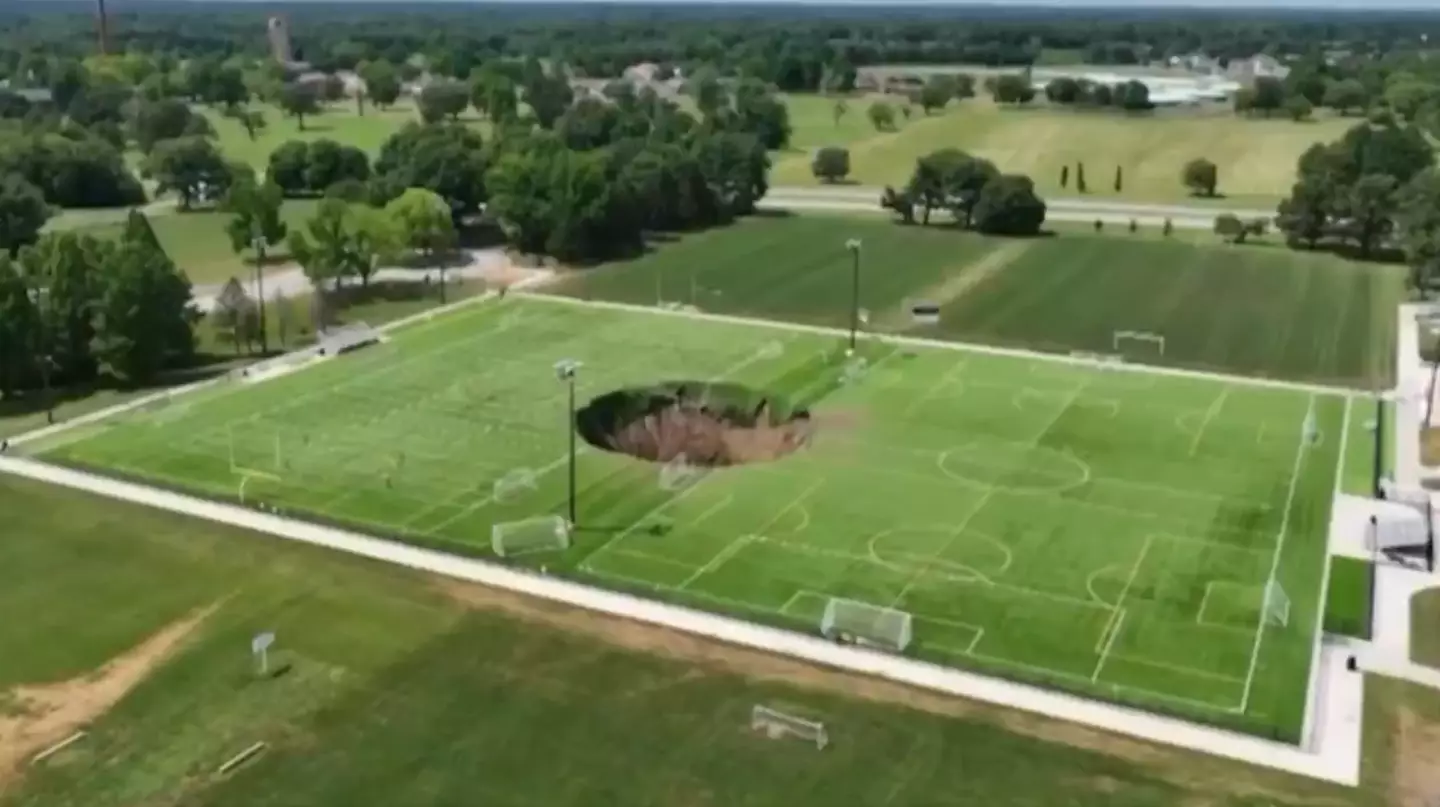The sinkhole formed a perfect 100 foot circle in the middle of the two pitches. (KSDK News)