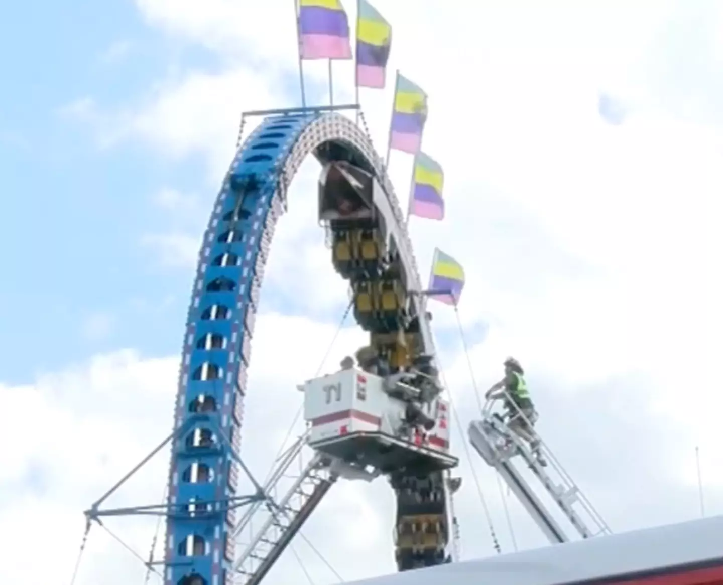 Firefighters had to use a raised platform to reach the riders.