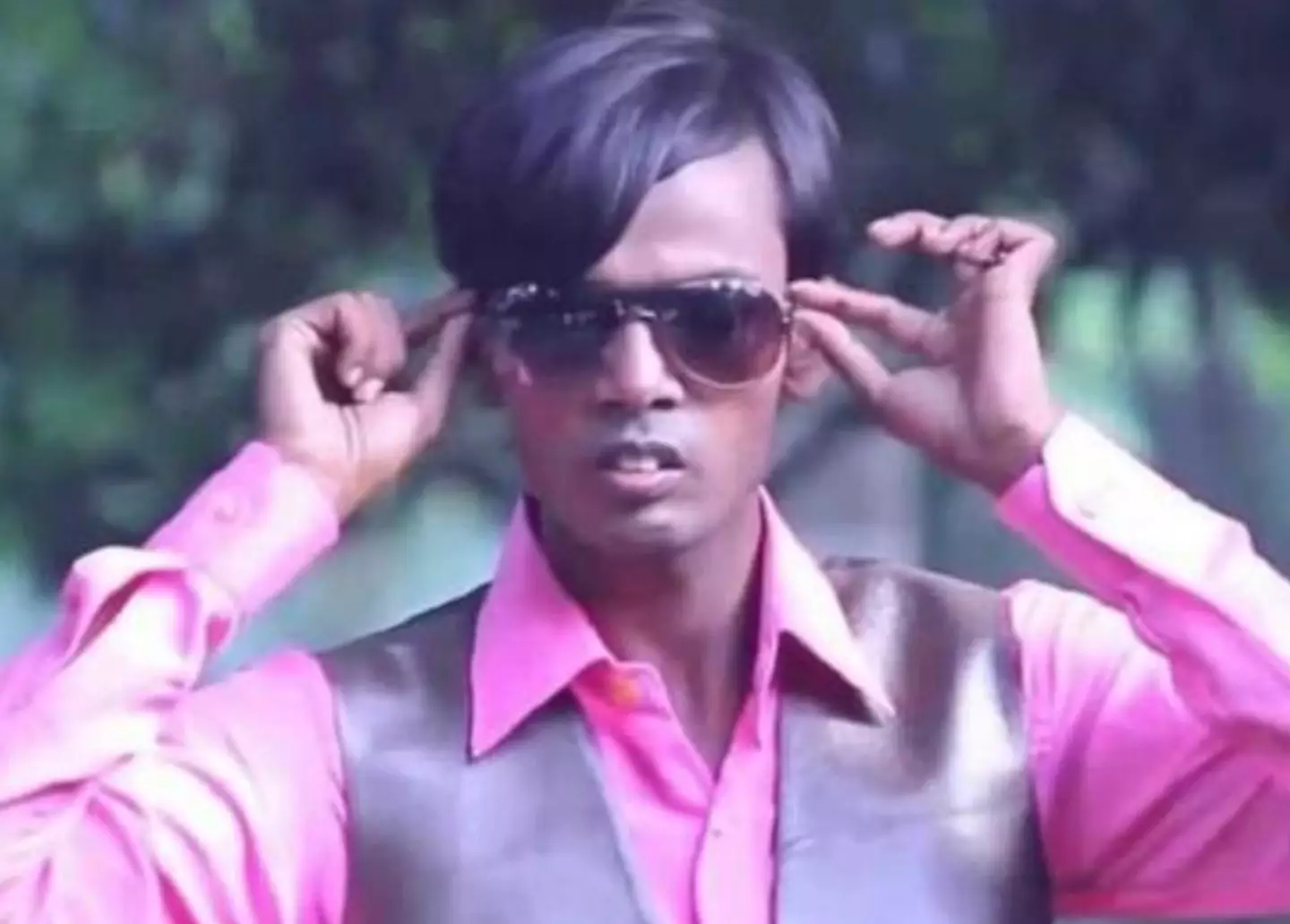 Hero Alom was arrested after singing while dressed as a police officer.
