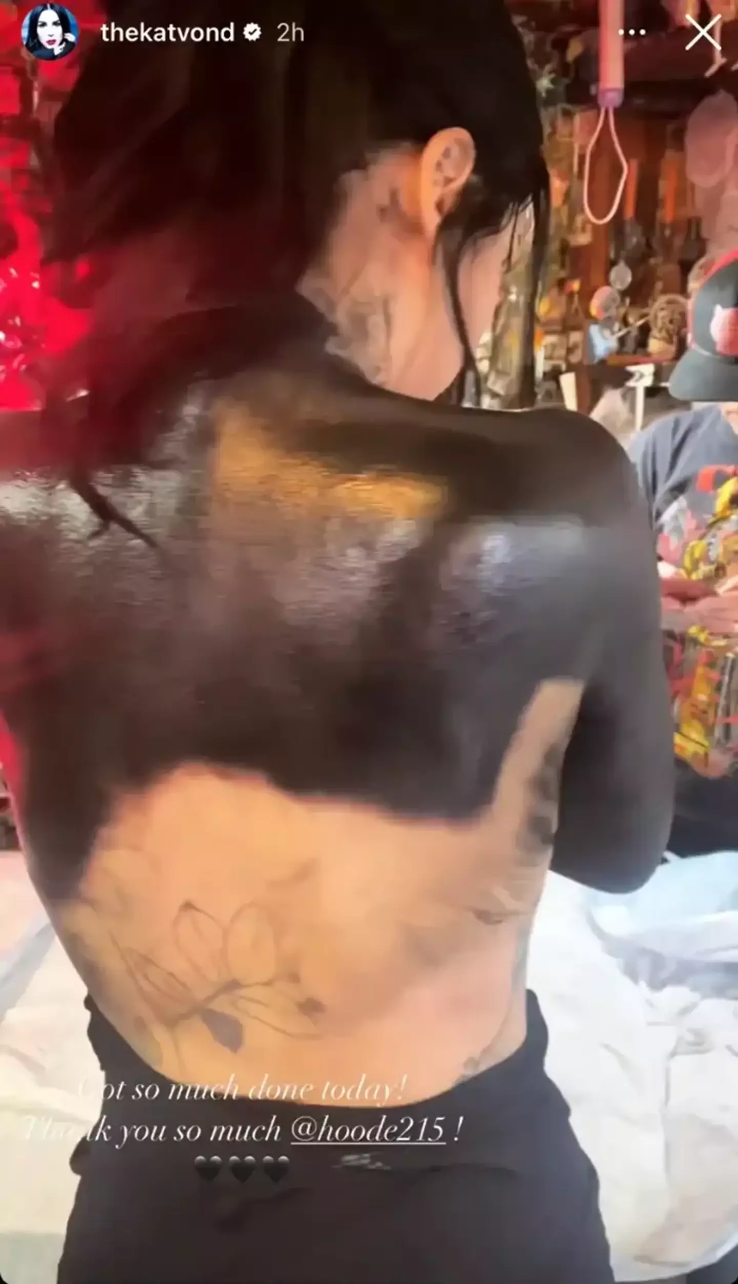Kat Von D's cover-up extends halfway down her back.
