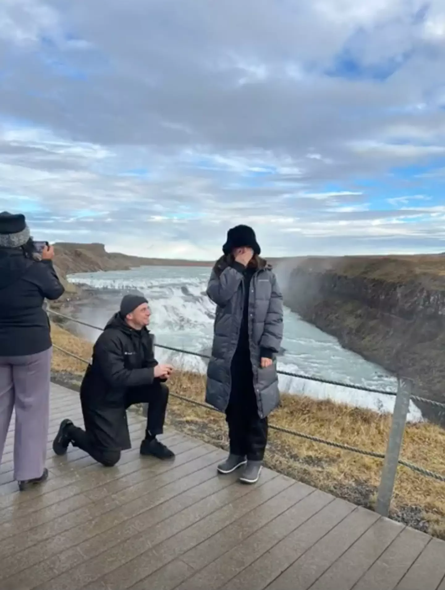 The tourist was seen taking photos of the scenery during the entire proposal.