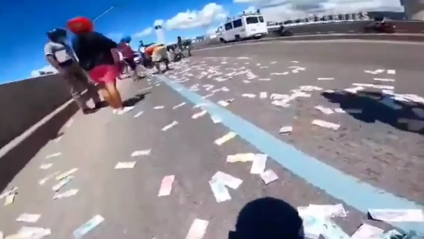 The cash flew all over the freeway.