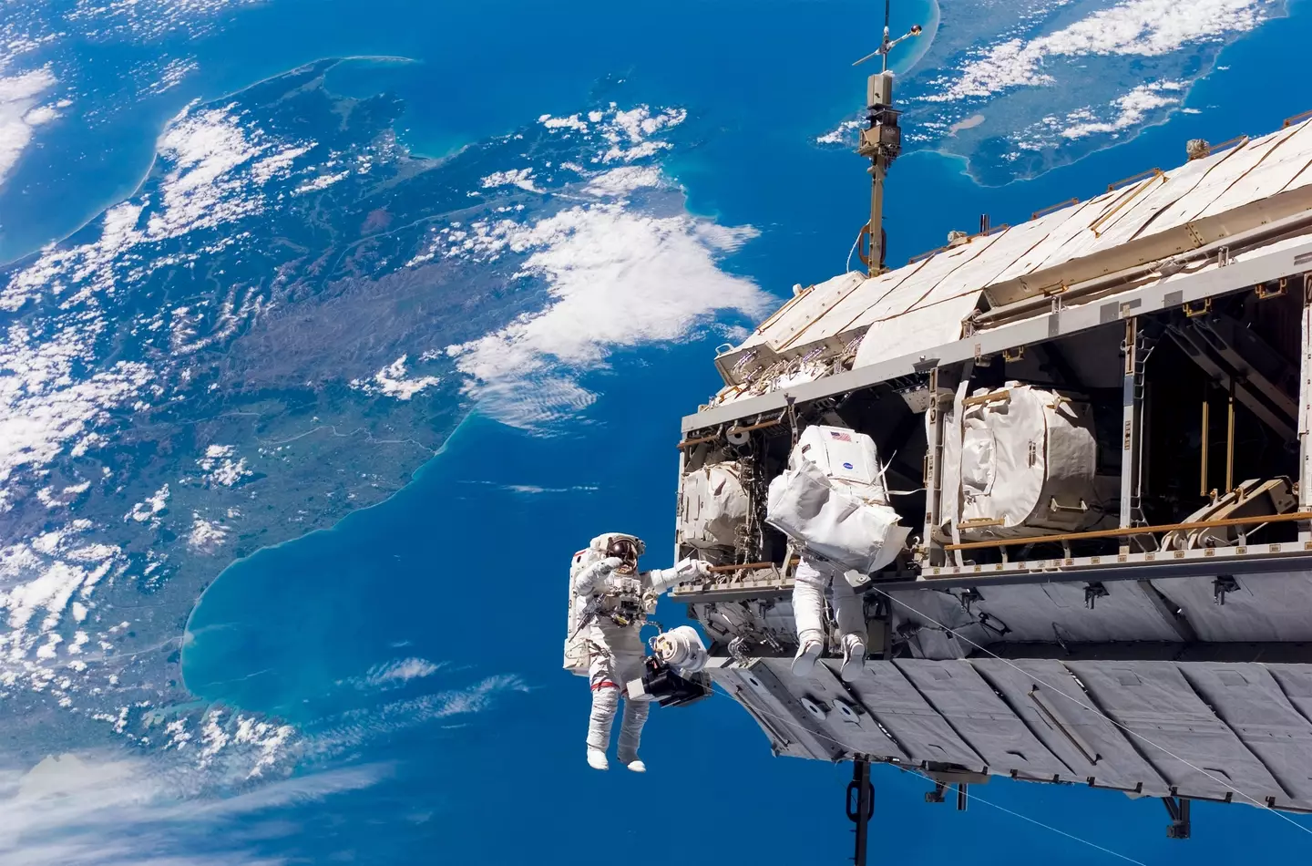 Astronauts on space walk on the ISS. (Alamy)