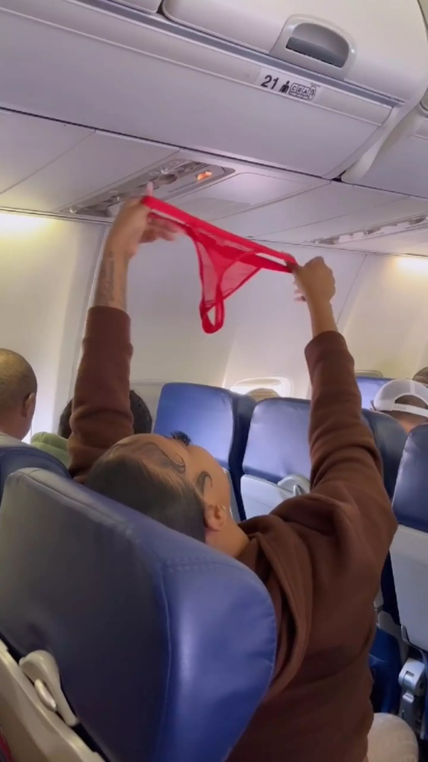 Vv Diamond appeared to be air-drying her red thong in front of the entire plane.