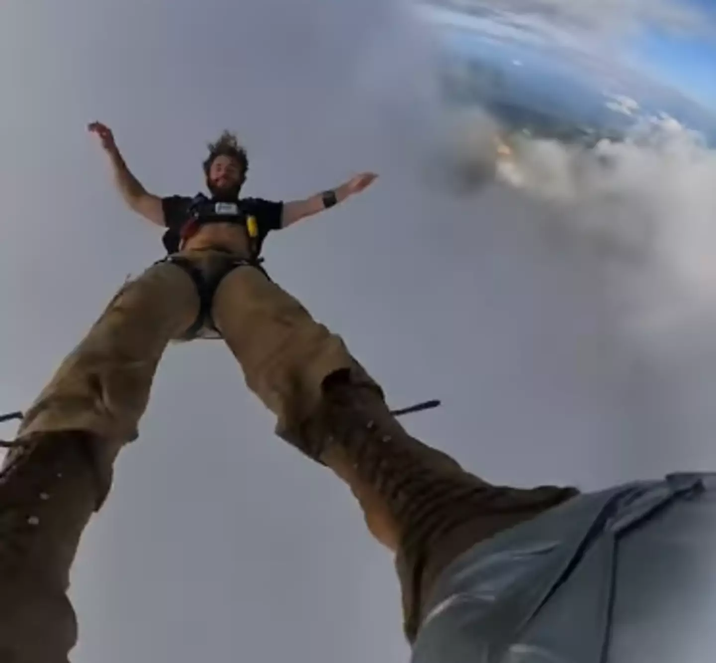 Skydiver Records Freefall Through Cloud.