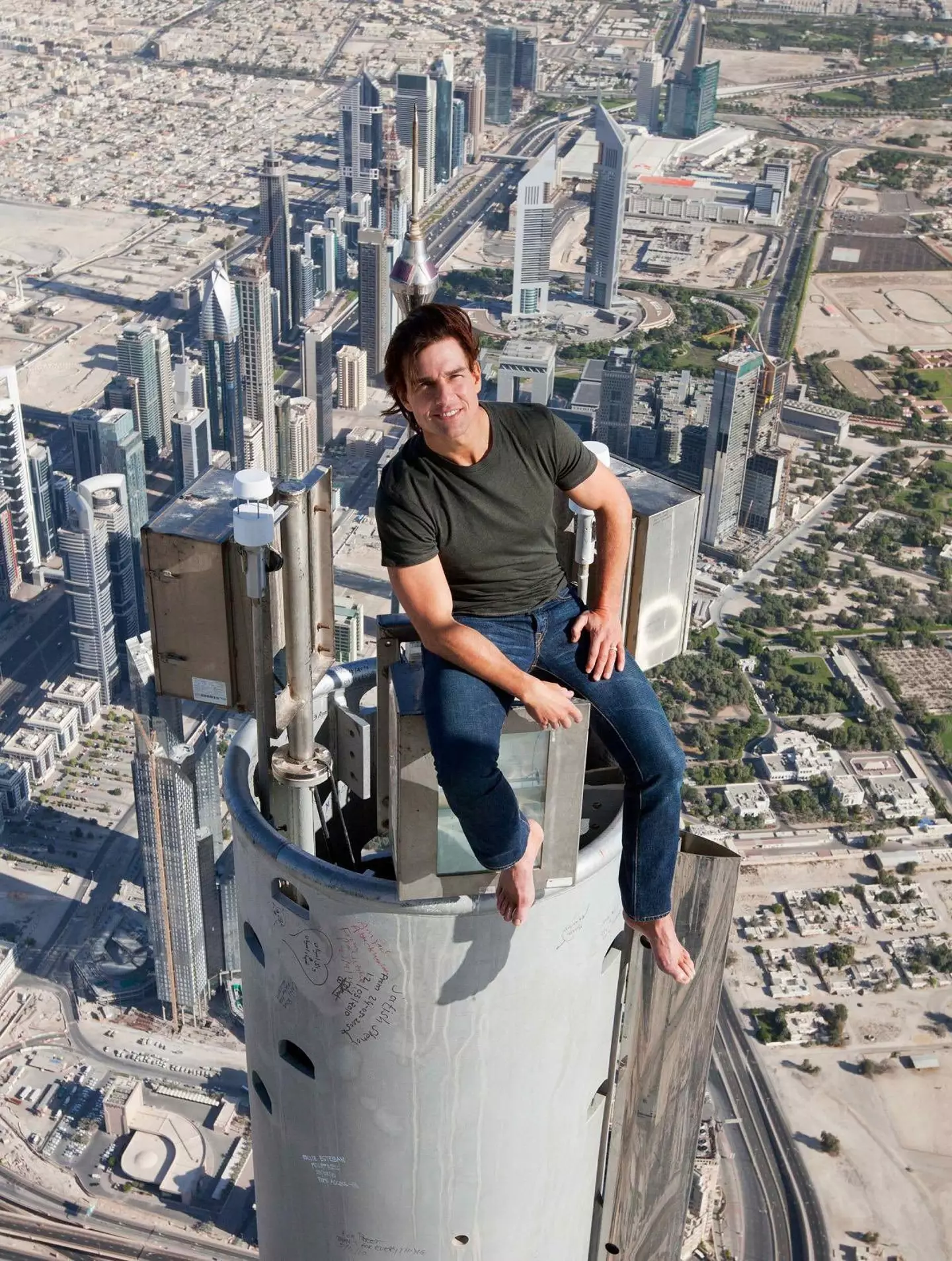 Tom Cruise on top of the Burj Khalifa, looking incredibly unphased. (X)