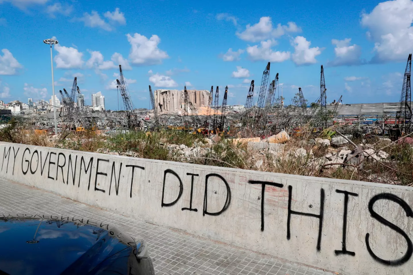 Graffiti overlooking the remains of the grain silo at Beirut port, which has become a haunting reminder of the explosion. (ANWAR AMRO/AFP via Getty Images)
