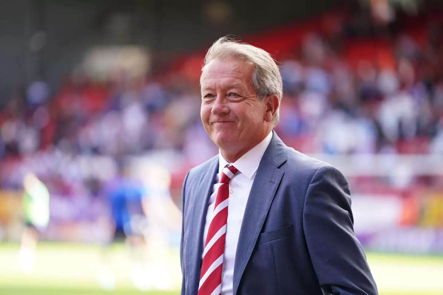 Former Charlton Athletic's manager Alan Curbishley on the pitch as a stand at The Valley is renamed after him. Image credit: Alamy