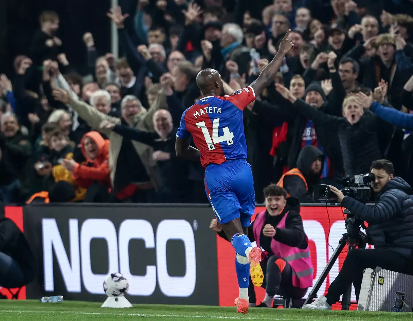 Jean-Philippe Mateta wheels away in celebration after scoring against Manchester United. Image: Getty