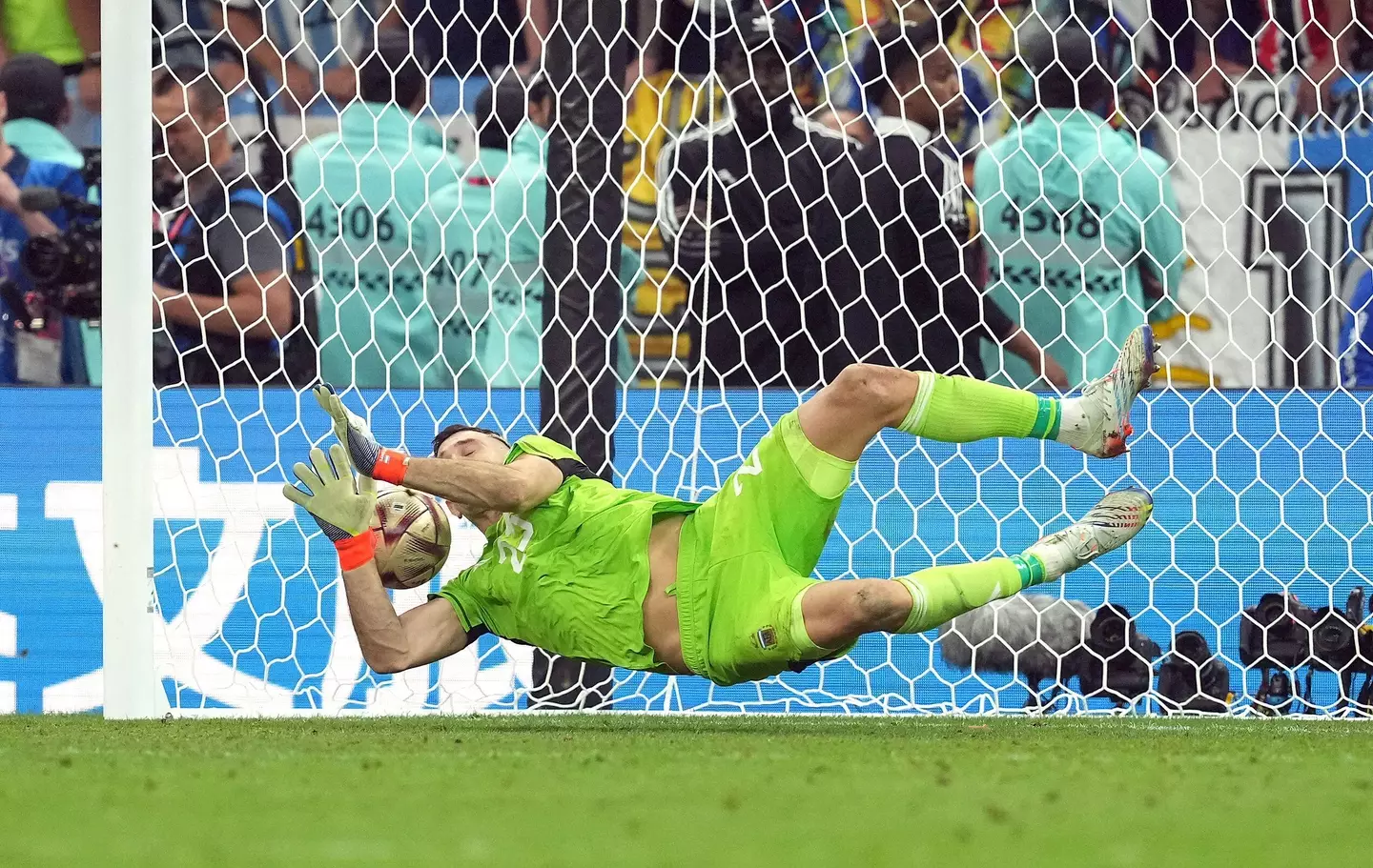Emiliano Martinez saved Kingsley Coman's penalty in the World Cup final shootout. (