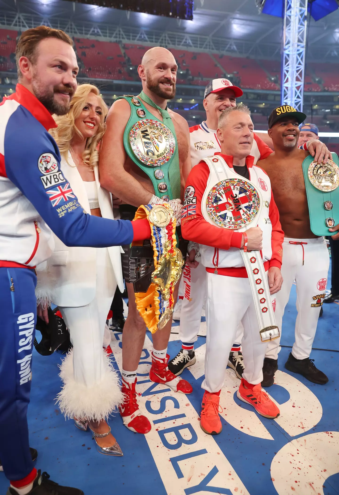 Tyson Fury with Paris Fury and John Fury after his win against Dillian Whyte. Image: Getty 