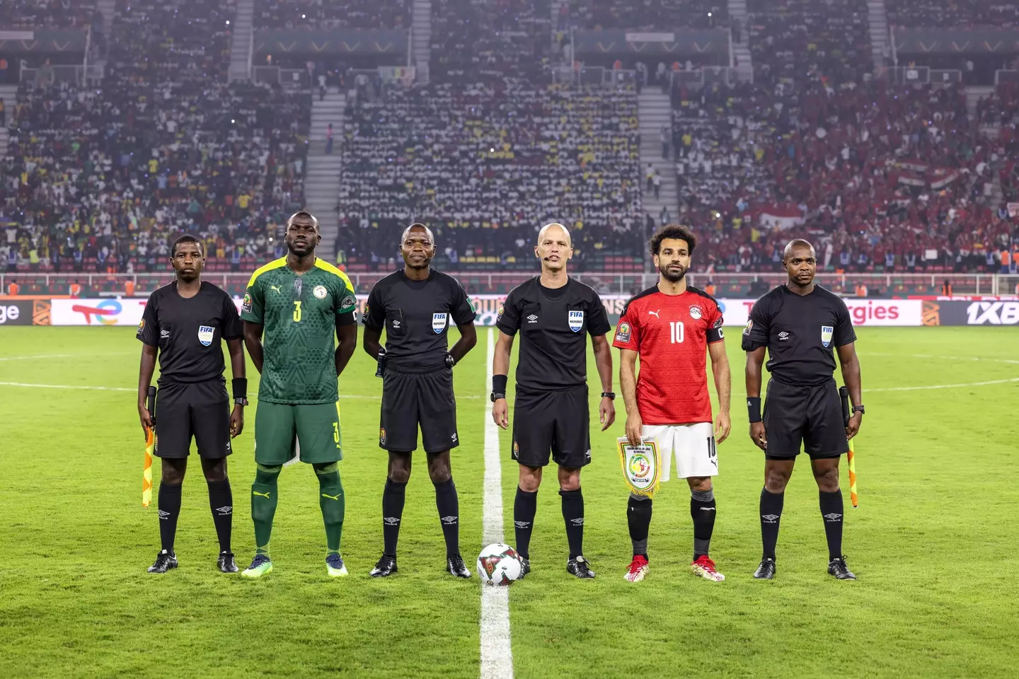 Kalidou Koulibaly of Senegal and Mohamed Salah of Egypt with official referee Victor Gomes pose for photo during the Africa Cup of Nations Final between Senegal and Egypt. Image: Alamy
