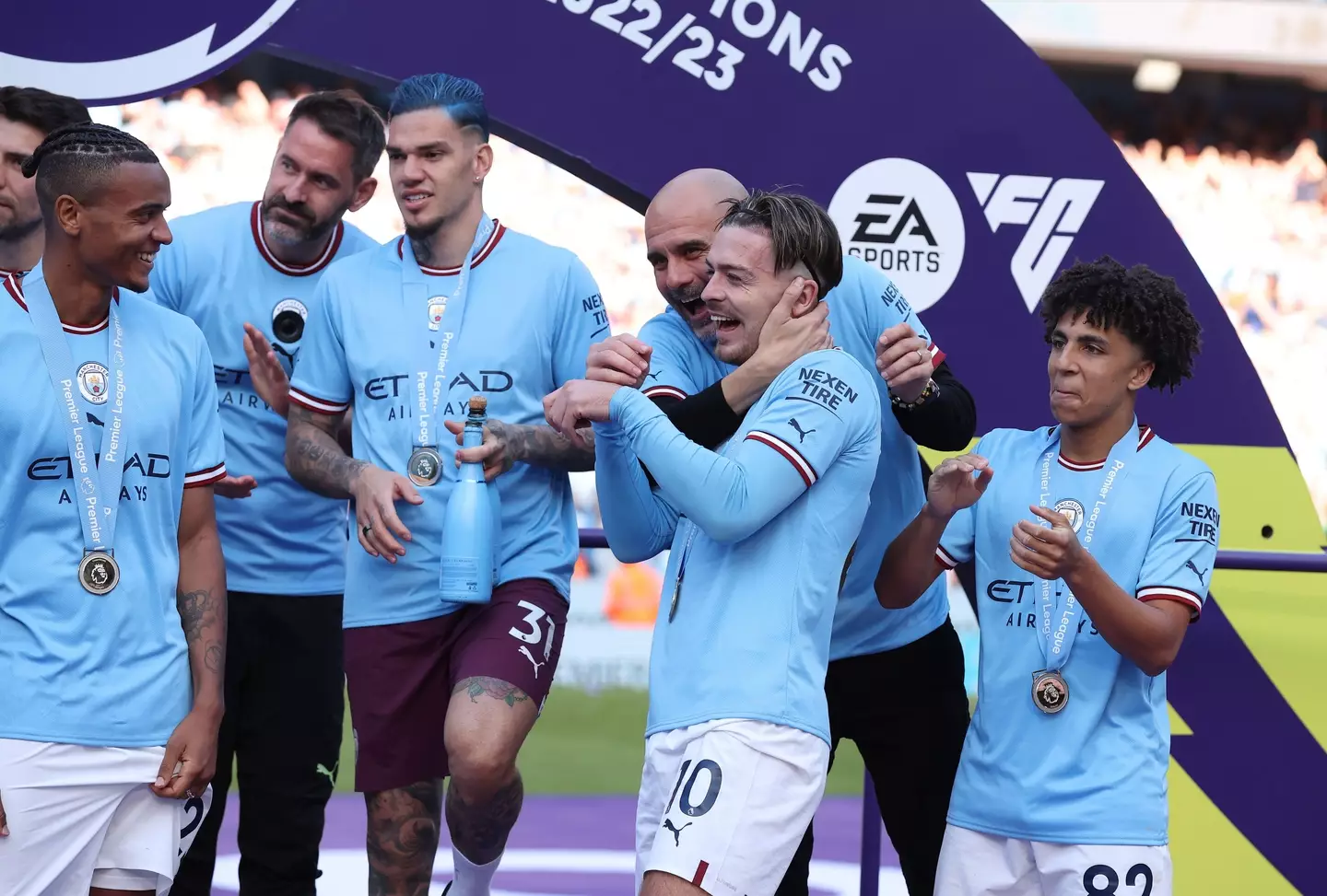 Jack Grealish and Pep Guardiola celebrate Manchester City's title win