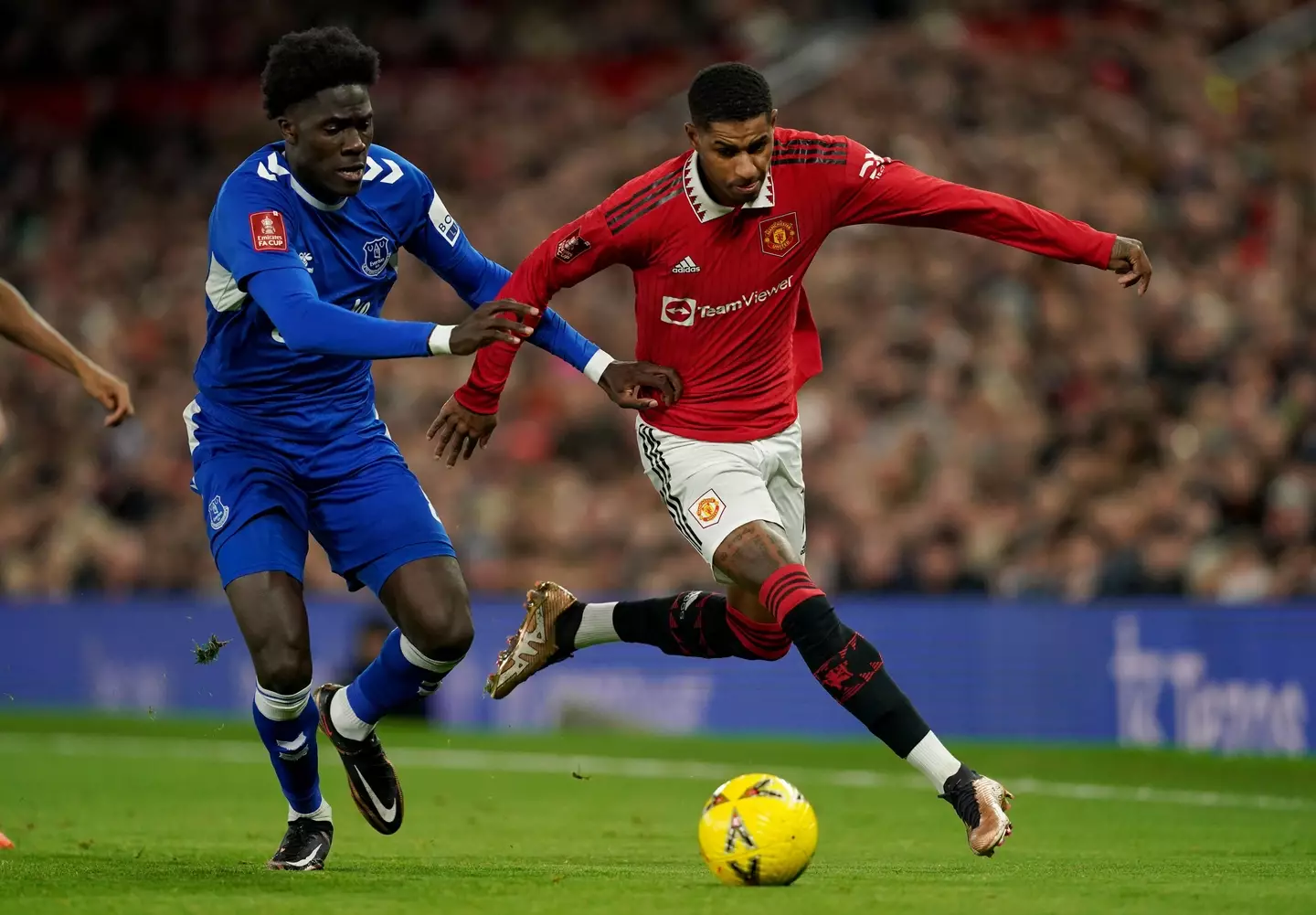 Rashford battles with Everton midfielder Amadou Onana. (Image
