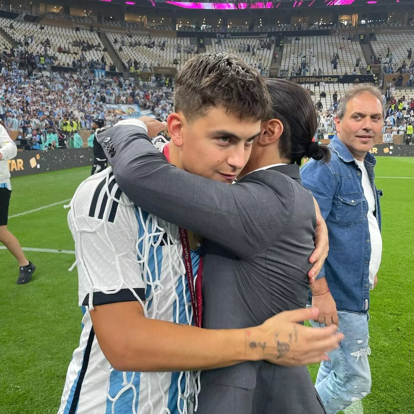 Salt Bae shares an awkward hug with Paulo Dybala. Image credit: Instagram/nusr_et