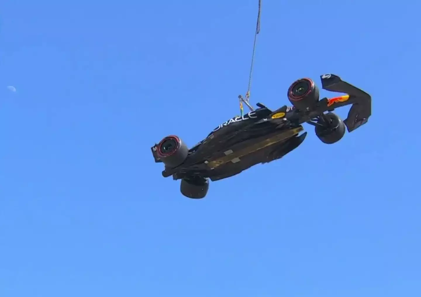 Sergio Perez has his car lifted away. Image: Twitter