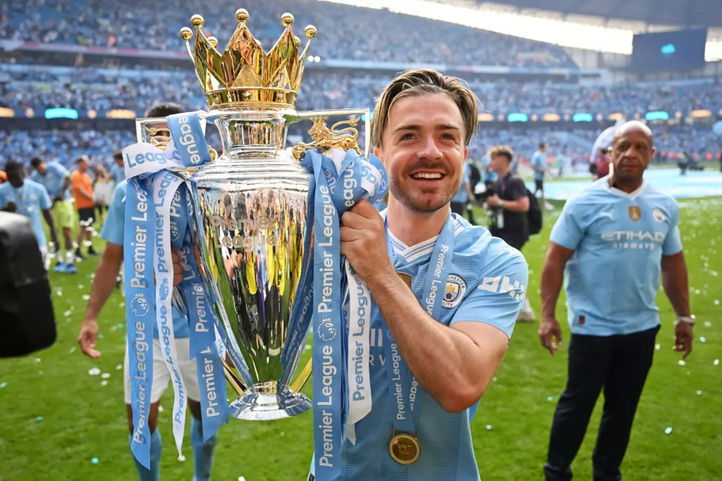 Jack Grealish celebrated with Manchester City after they won a historic fourth successive Premier League title in 2023/24. (Image: Getty)