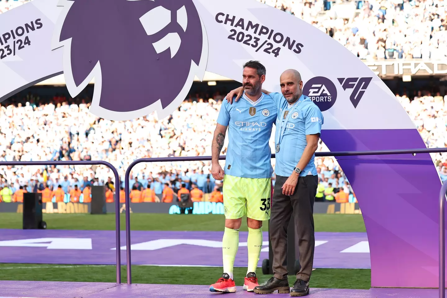Scott Carson with Pep Guardiola during Manchester City's Premier League title celebrations. Image: Getty 
