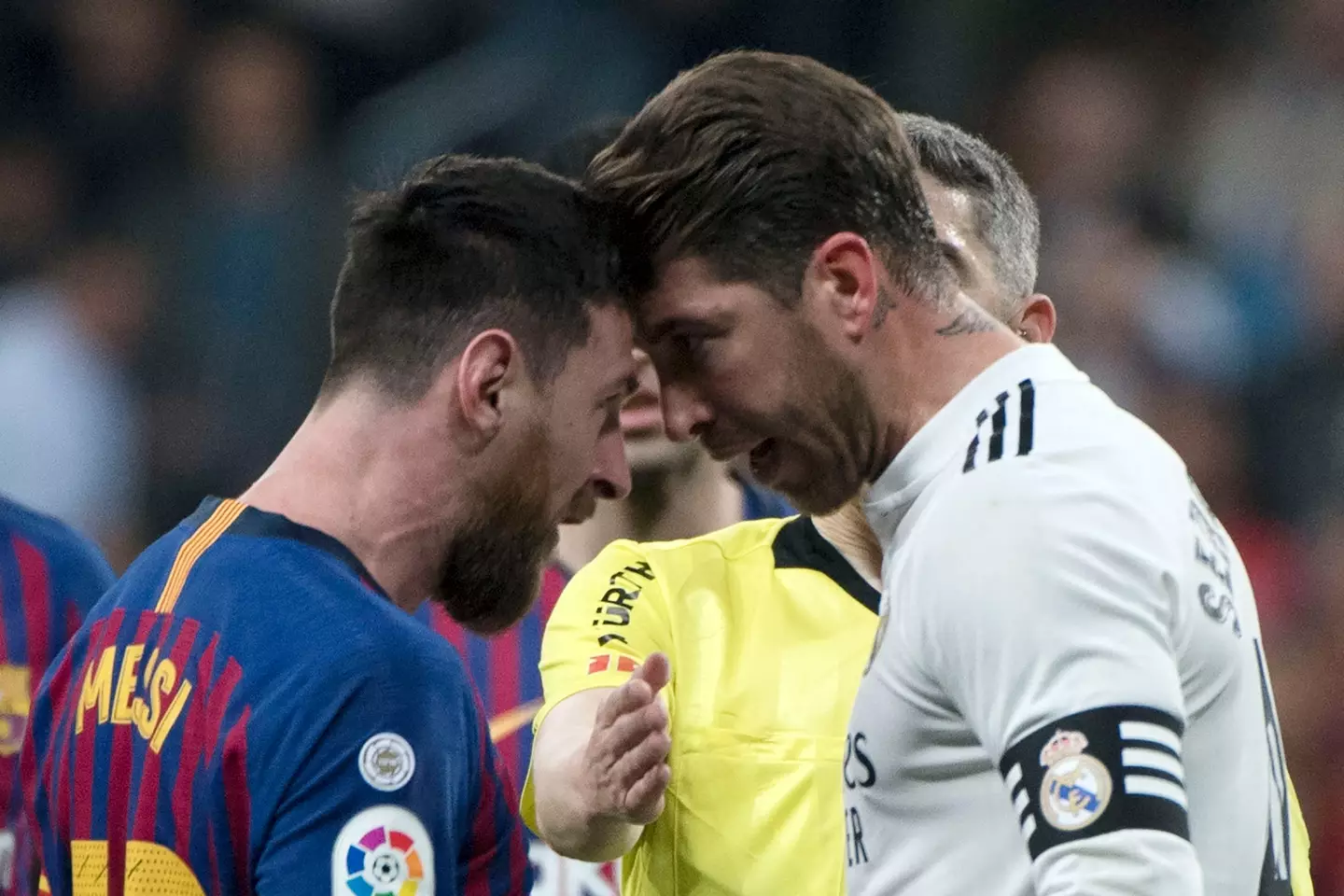 Sergio Ramos and Lionel Messi clash during an El Clasico meeting. Image: Getty